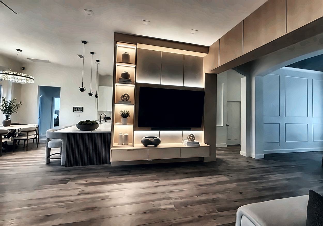 Kitchen and living area with a fluted island base and an illuminated display column